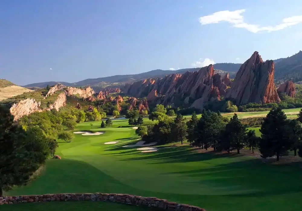 Scenic Colorado golf course landscape with strategically placed trees lining the greens and pathways